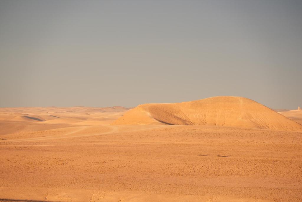 a sand dune in the middle of the desert at Amazigh van Agafay in Oumnas