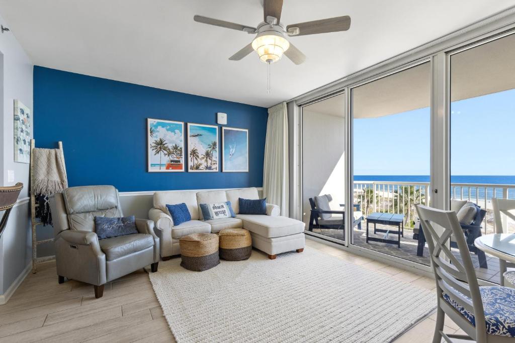 a living room with a couch and a chair at Beach Club unit 502C- Catalina in Gulf Highlands