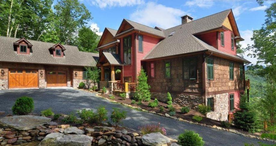 a large red house with a driveway at Overlook Estate in The Farm in Banner Elk