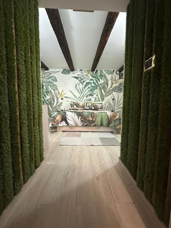 a living room with green curtains and a couch at Flower Home in Crotone