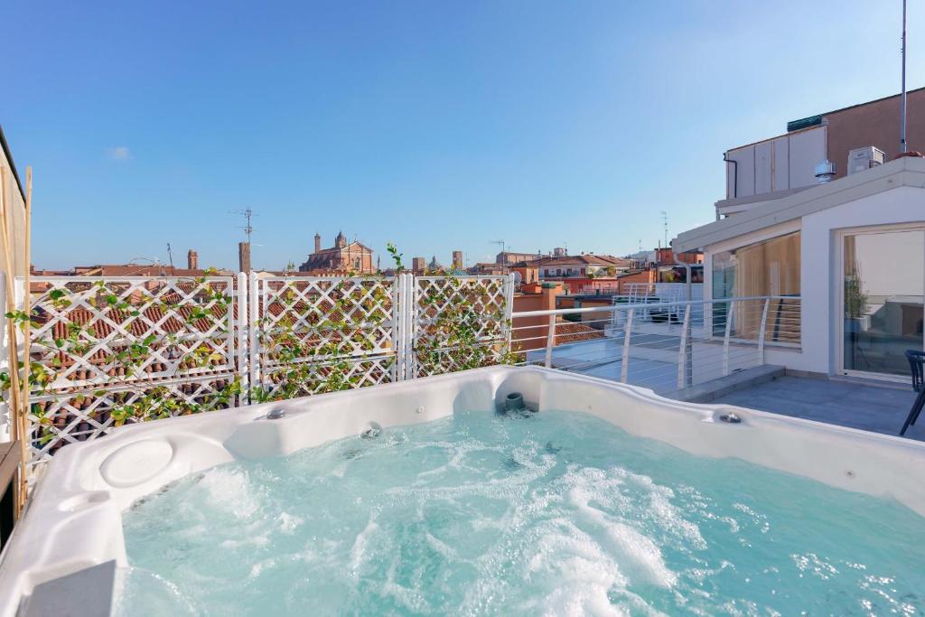 a hot tub on the balcony of a house at The Rooftop in Bologna