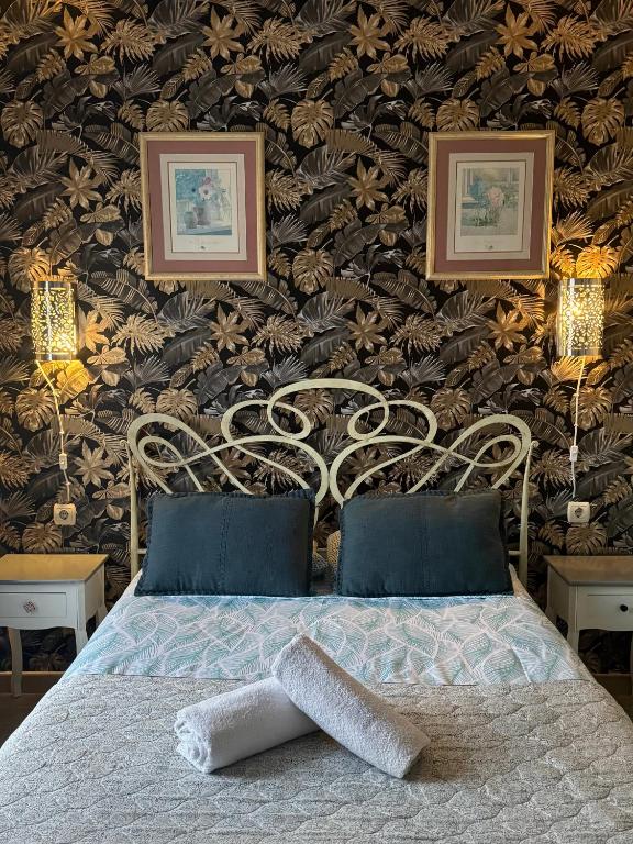 a bedroom with a bed and a wall with at Málaga Centro Hostel in Málaga