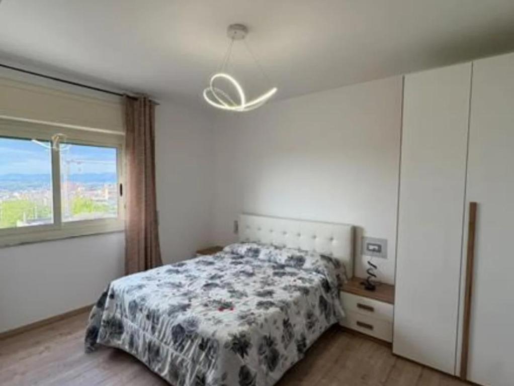 a bedroom with a bed and a window at B&B antonia in SantʼAntonio Abate