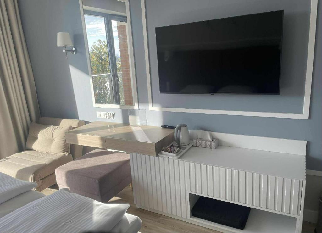 TV a/nebo společenská místnost v ubytování Apartamenty Pułaskiego