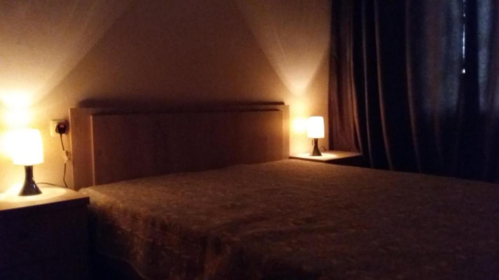 Postel nebo postele na pokoji v ubytování Dima's Guesthouse