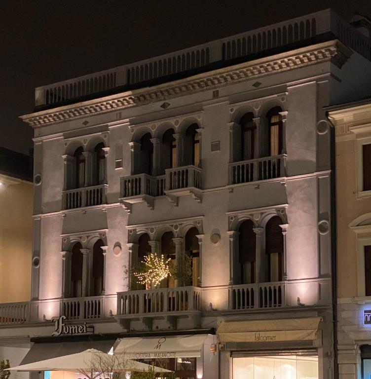 a large white building with a christmas tree on it at Palazzina Mori - Luxury B&B in San Donà di Piave