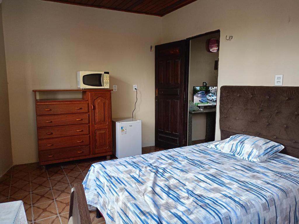 Ένα ή περισσότερα κρεβάτια σε δωμάτιο στο Suíte Executiva no Coração de Belém