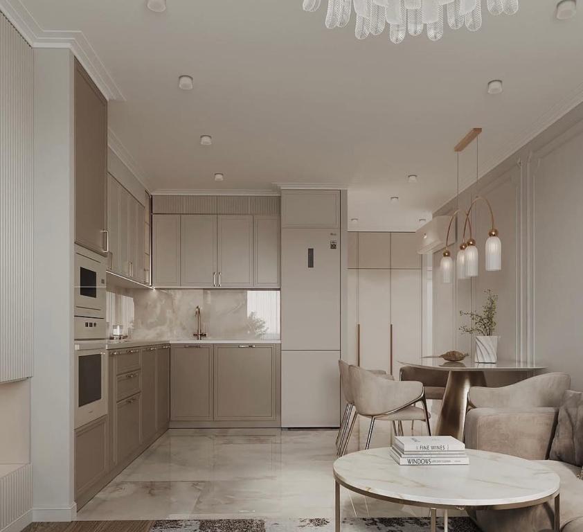 a kitchen and living room with a table and chairs at Louise Delux- Free privat parking in Nyíregyháza