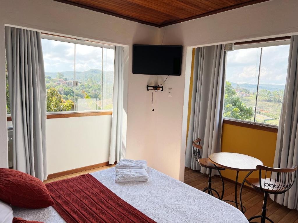 Postel nebo postele na pokoji v ubytování Pousada Vista de Lavras