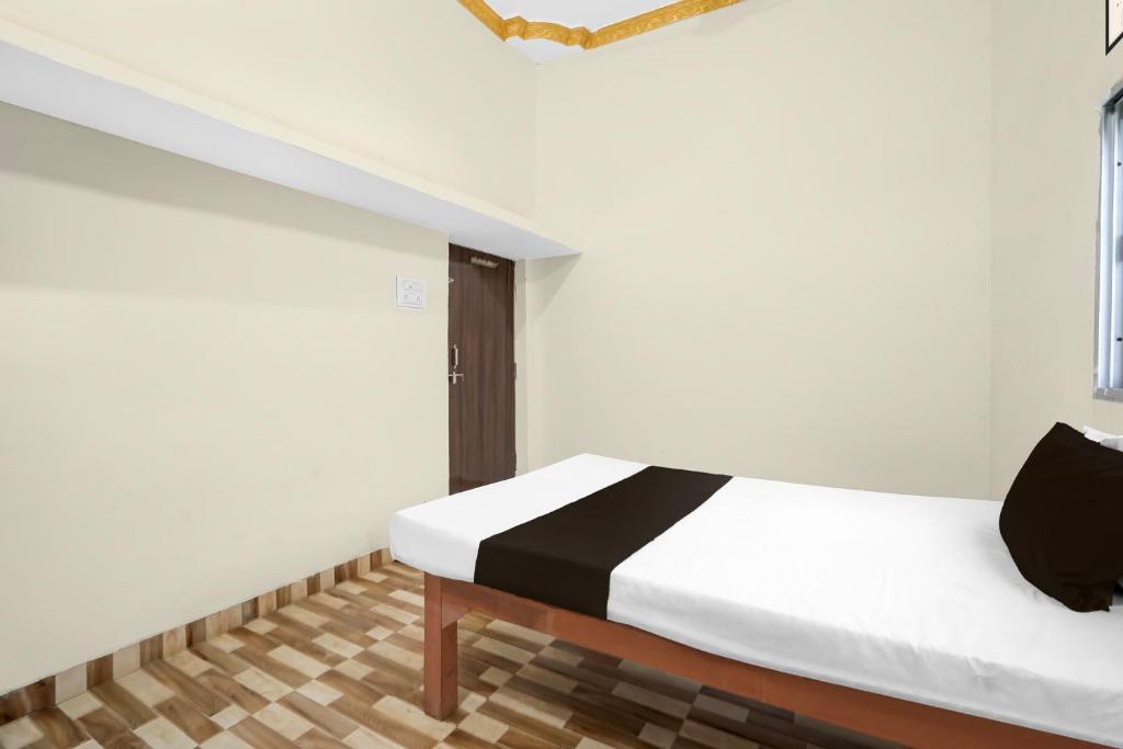 Ένα ή περισσότερα κρεβάτια σε δωμάτιο στο Hotel O Hamar Mitan