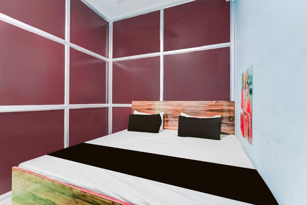 Ένα ή περισσότερα κρεβάτια σε δωμάτιο στο SPOT ON Yatri Nivas Hotel