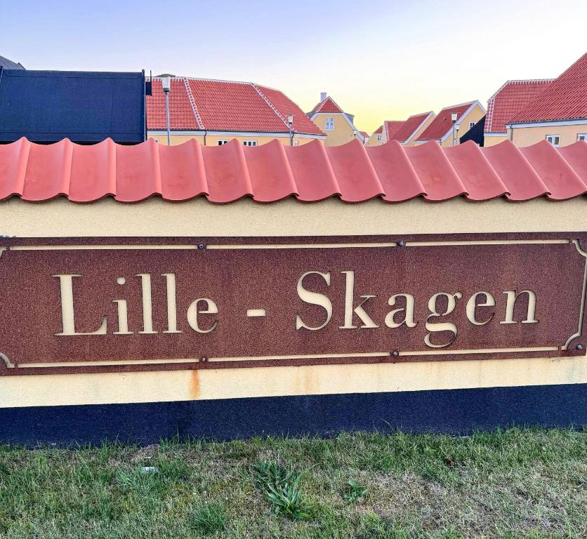 a sign with the words little slayer on a building at Holiday Home With Courtyard In Lille Skagen in Skagen