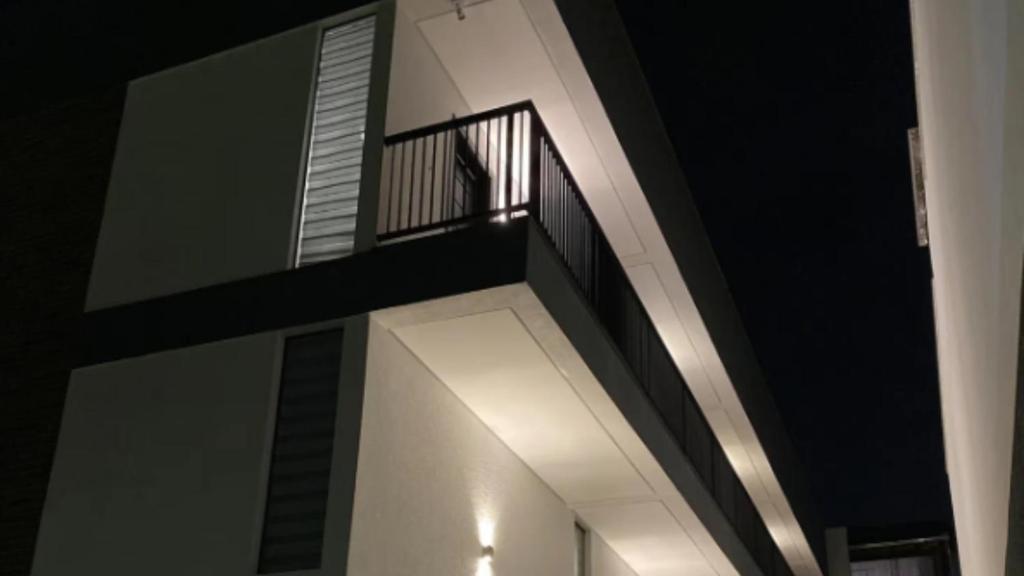 a building with a staircase on the side of it at Compact Loft Residencial Flipchave CLO000 in Boa Vista