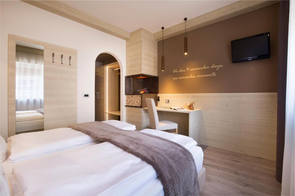 Postel nebo postele na pokoji v ubytování Hotel Azola