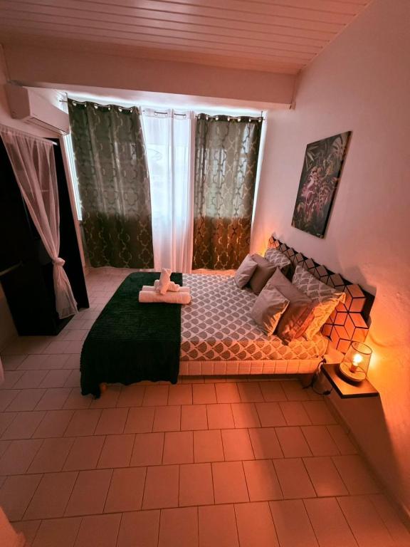 Giường trong phòng chung tại Le Neo-Cayenne