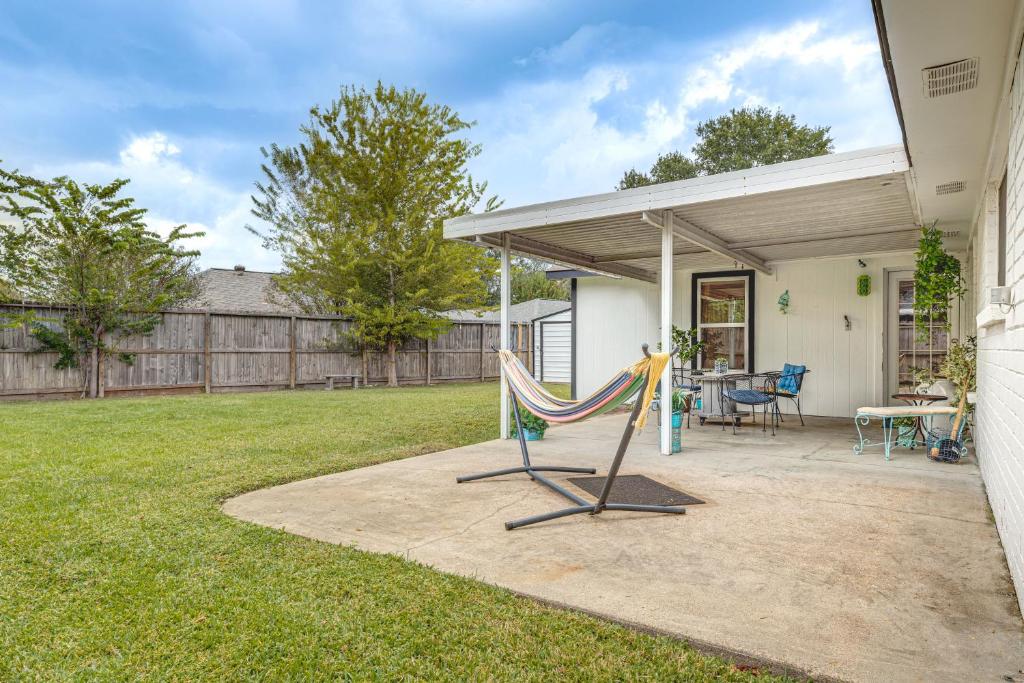 a patio with a hammock in a yard at Families Welcome! Recently Renovated Home in Katy in Katy