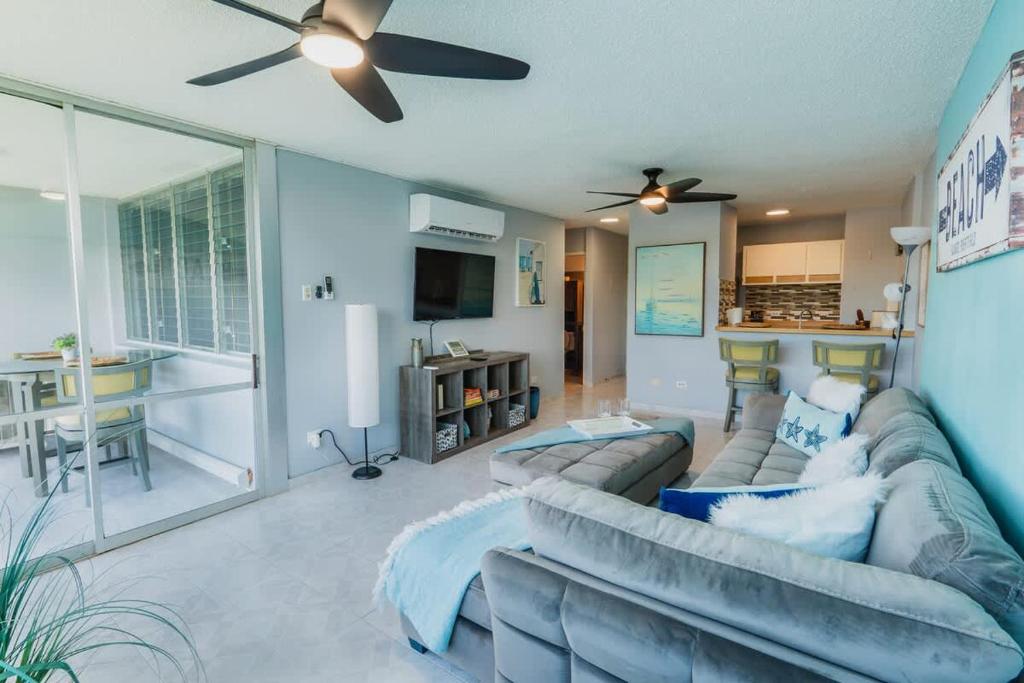 a living room with a couch and a ceiling fan at Marena Seaview Condo in Dos Marinas, Fajardo in Beltran