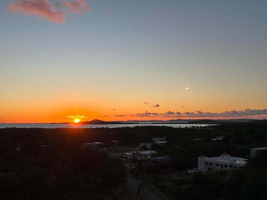 a sunset over the water with the sun in the sky at Marbella | PH Rooftop Oasis in Costa Brava, Ceiba in Santa Maria