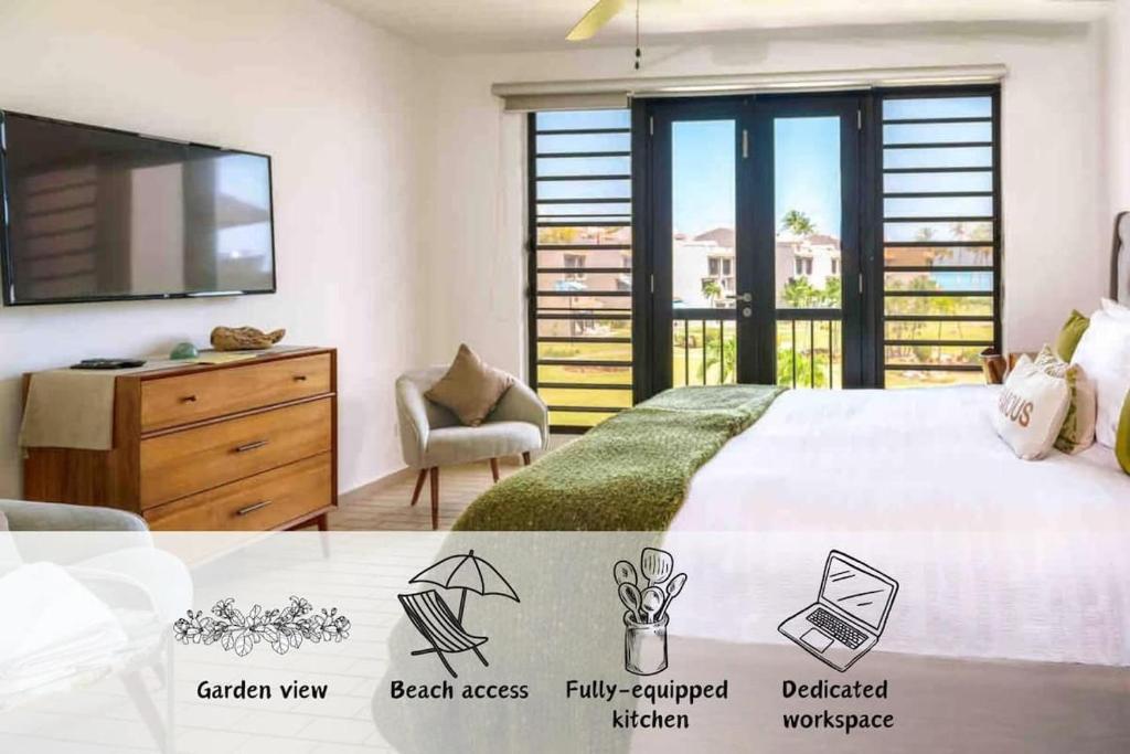 a bedroom with a bed with a television and a dresser at Selah | Travelers Nesters in Palmas Del Mar in Buena Vista