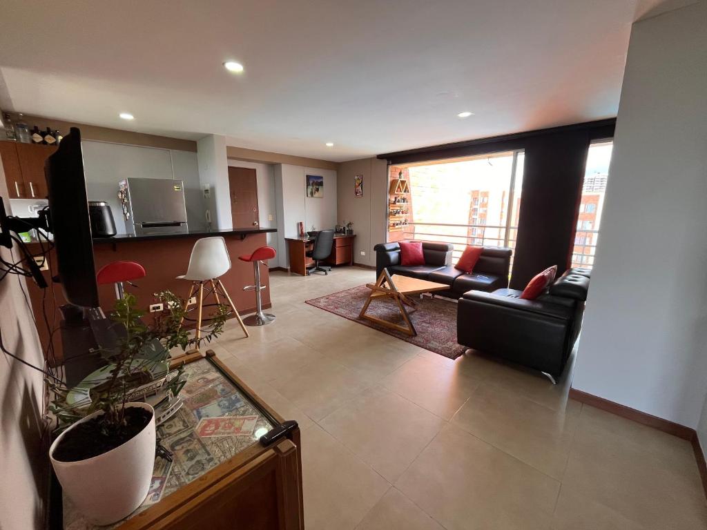 Un lugar para sentarse en Apartamento Amplio Nuevo