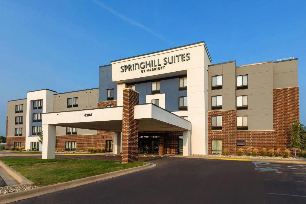 a building with a sign on the front of it at SpringHill Suites by Marriott Sioux Falls in Sioux Falls