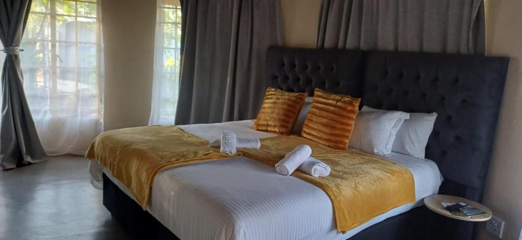 Ένα ή περισσότερα κρεβάτια σε δωμάτιο στο Risima Guest Lodge Hazyview