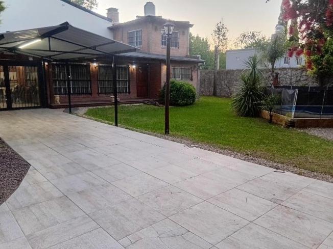 a house with a patio with an umbrella at Quinta El Zorzal in La Unión
