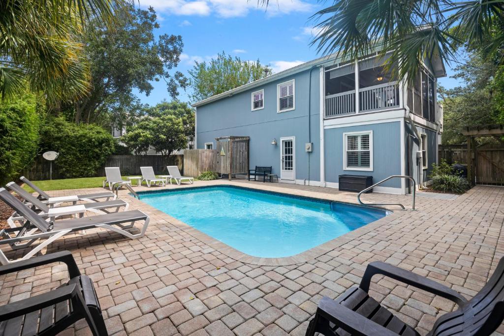a swimming pool in front of a house at CA411: 411 Carolina Blvd. in Isle of Palms
