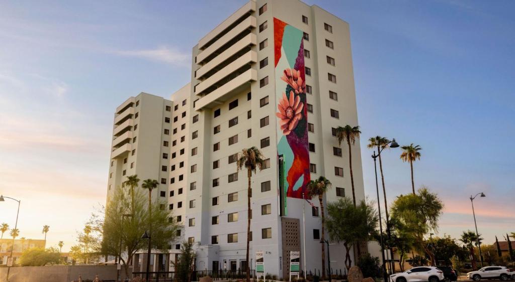 a large white building with a mural on it at Astral Desert Retreats in Mesa