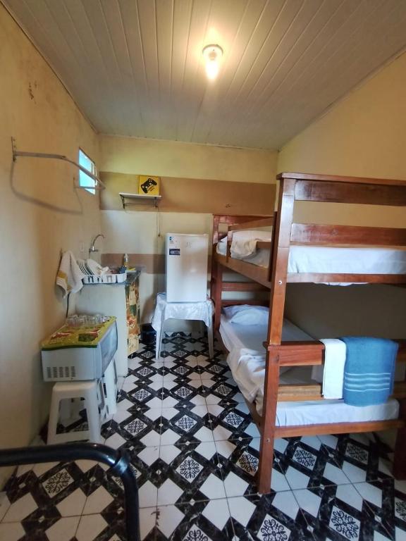 En eller flere senge i et værelse på Kit Net moderna para COP 30