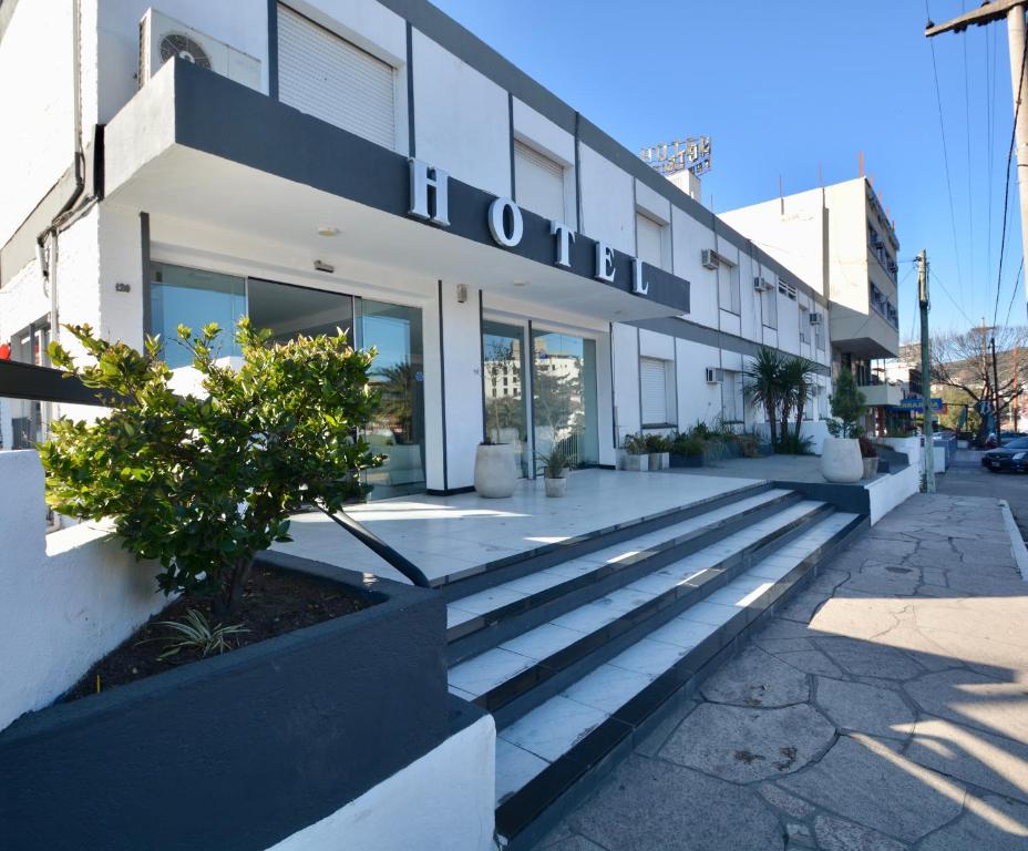 a building with a bunch of steps in front of it at Hotel Montecarlo PSH in Villa Carlos Paz