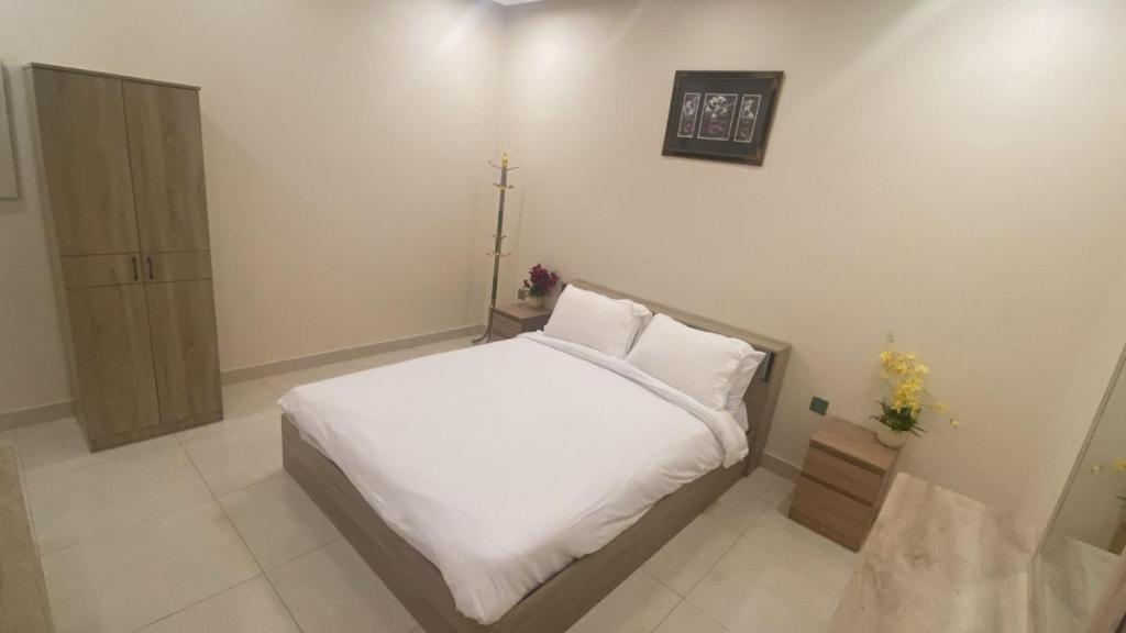 Postel nebo postele na pokoji v ubytování شاليهات بلو لاجون