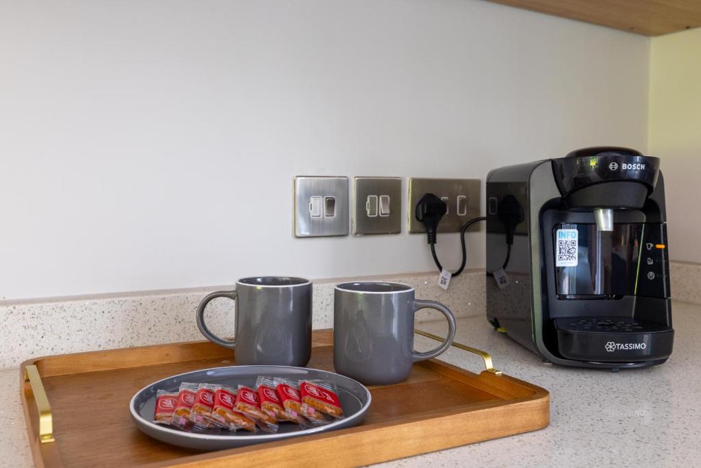 Příslušenství pro přípravu čaje a kávy v ubytování Maisonette