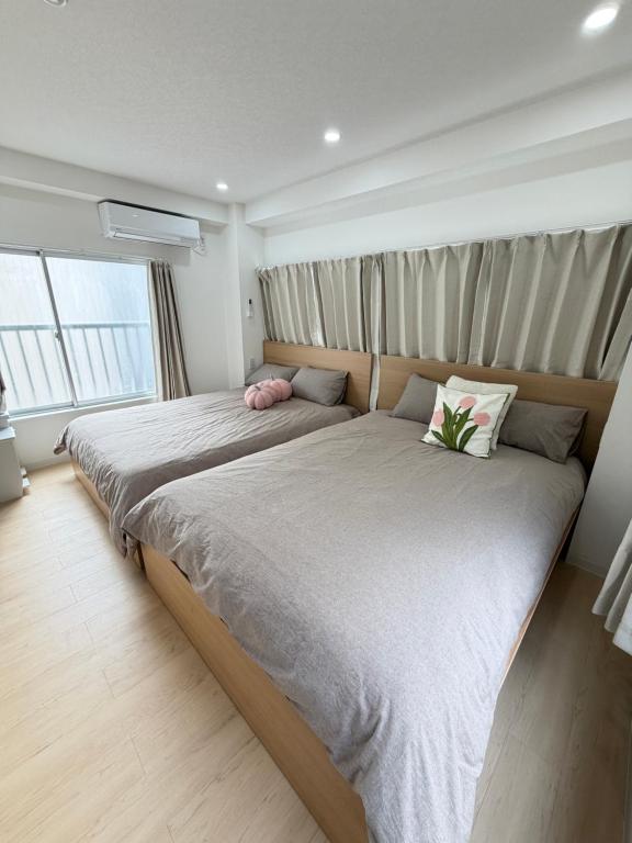 Ένα ή περισσότερα κρεβάτια σε δωμάτιο στο TOMI Hotel 神保町301