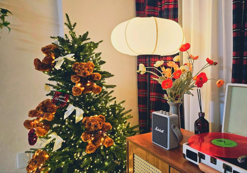 a christmas tree sitting on a table with a radio at Stay EROB in Seoul
