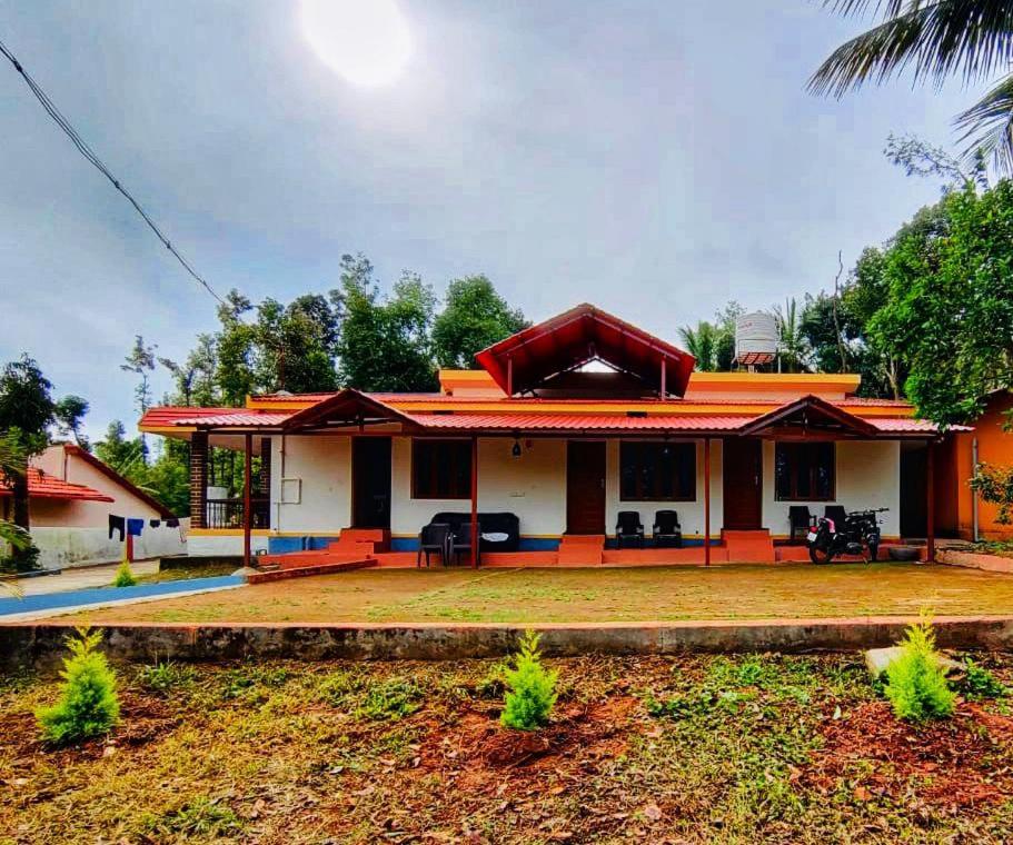 a small house with an orange roof at Mountain Pearl Villa in Avathi