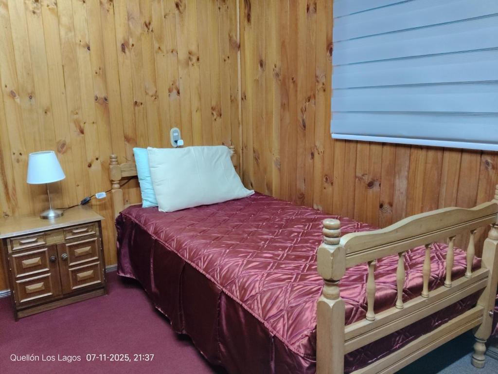 Ένα ή περισσότερα κρεβάτια σε δωμάτιο στο Hospedaje Mirador del Puerto