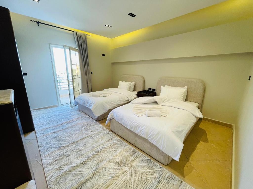 Ένα ή περισσότερα κρεβάτια σε δωμάτιο στο فندق ديزرت روز -Desert Rose Hotel