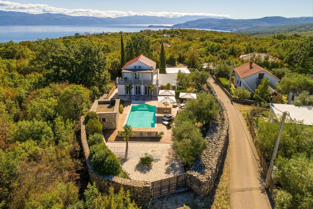 an aerial view of a house with a swimming pool at Villa 5 elements in Gostinjac