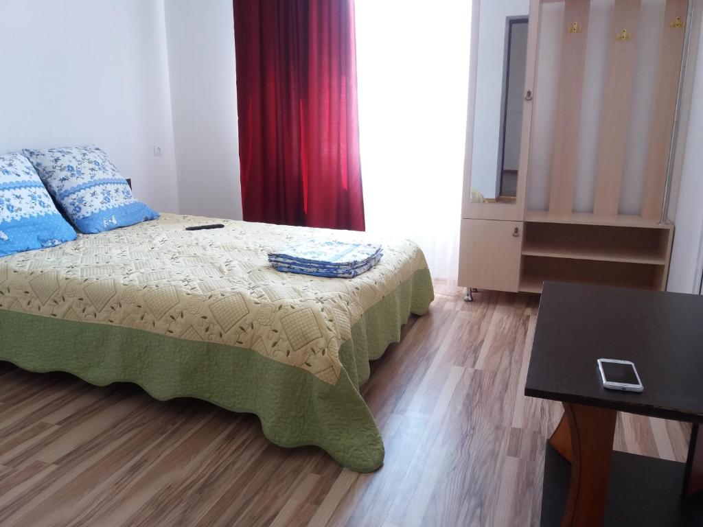 Postel nebo postele na pokoji v ubytování Guest House Arbat