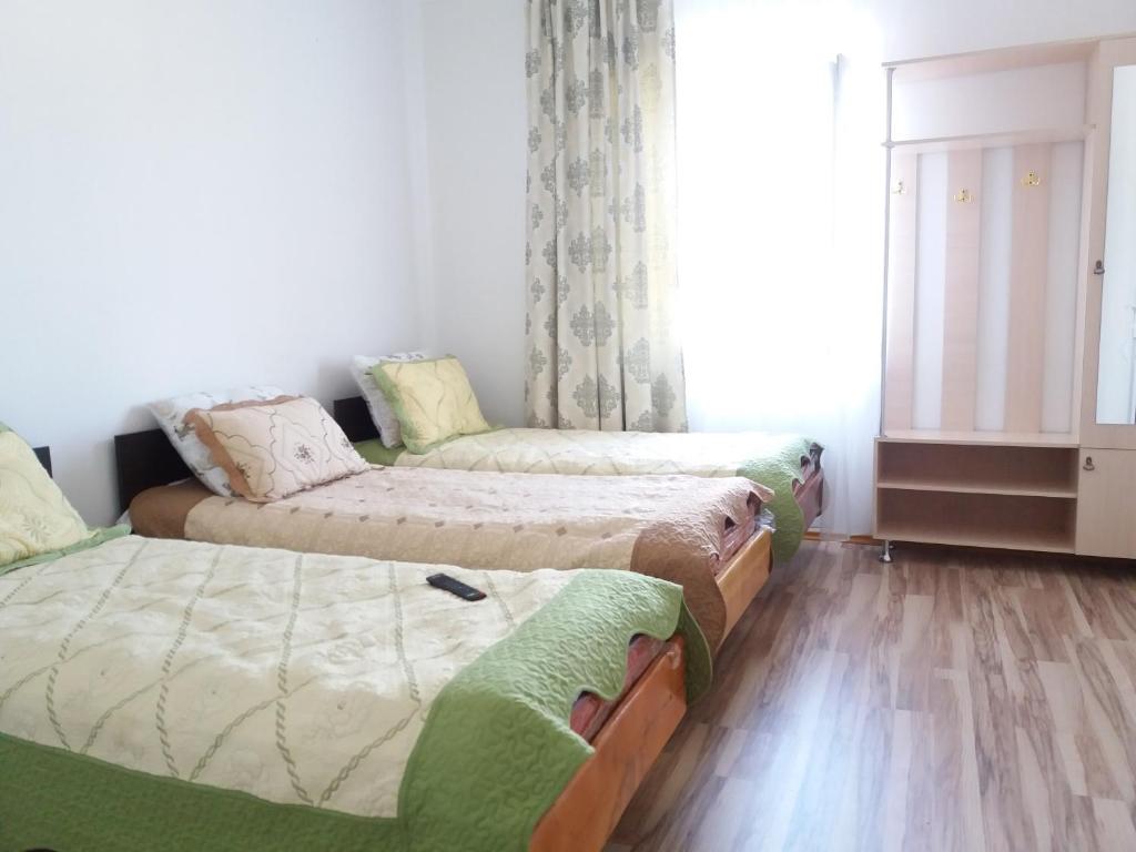 Postel nebo postele na pokoji v ubytování Guest House Arbat