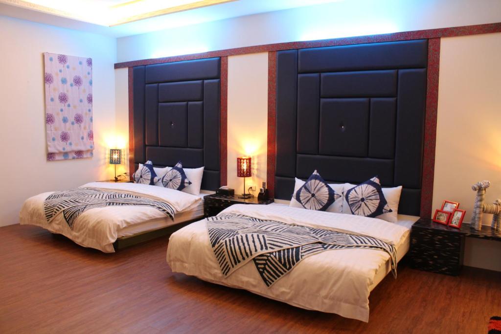Postel nebo postele na pokoji v ubytování Yilan Amy B&B