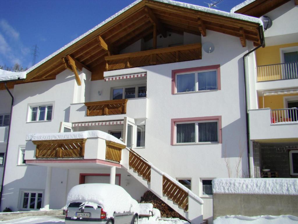 an apartment building with snow on the ground at Apartment in Strengen near Ski Slopes in Strengen