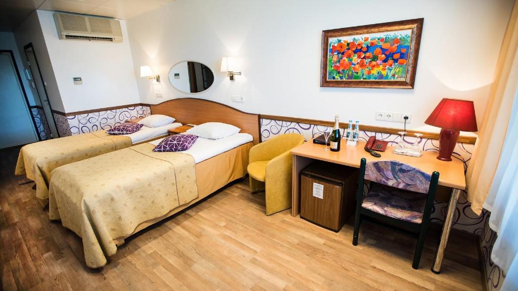 Postel nebo postele na pokoji v ubytování Hestia Hotel Susi