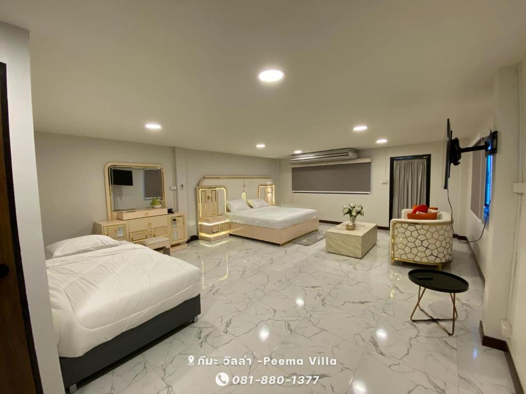 a bedroom with two beds and a living room at Peema Villa ภีมะ วิลล่า in U Thong