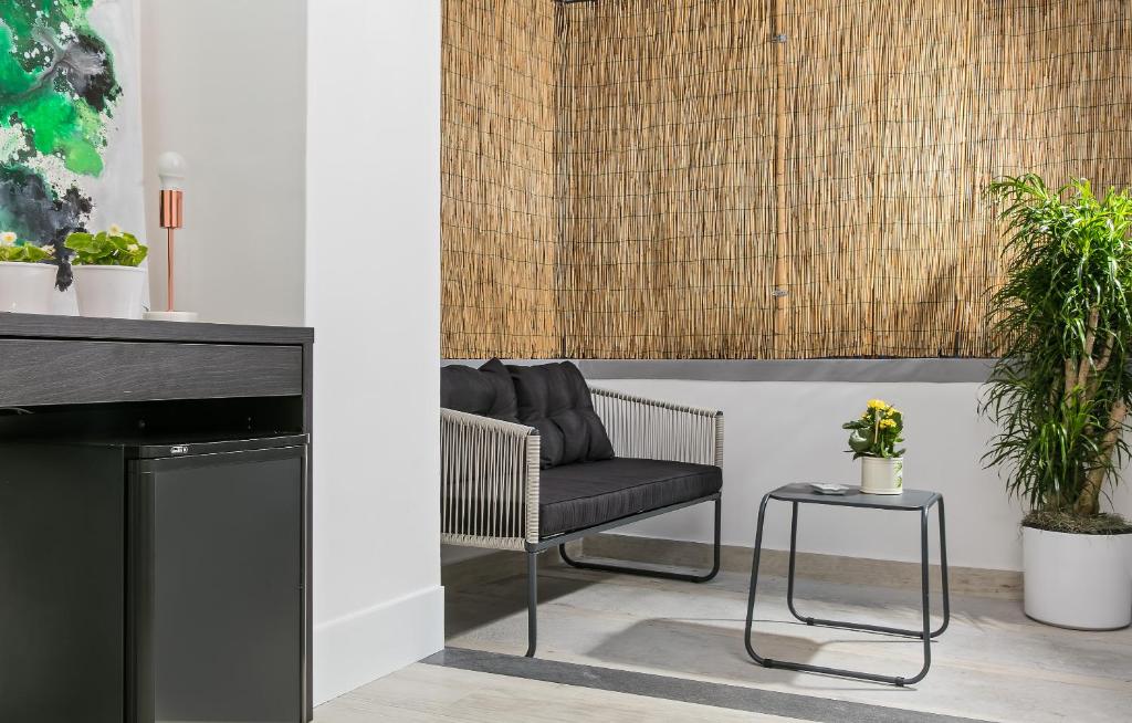 a living room with a chair and a table at Fuorlovado 40 in Capri