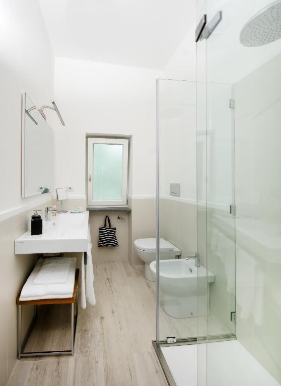 a bathroom with a sink and a toilet and a shower at Fuorlovado 40 in Capri