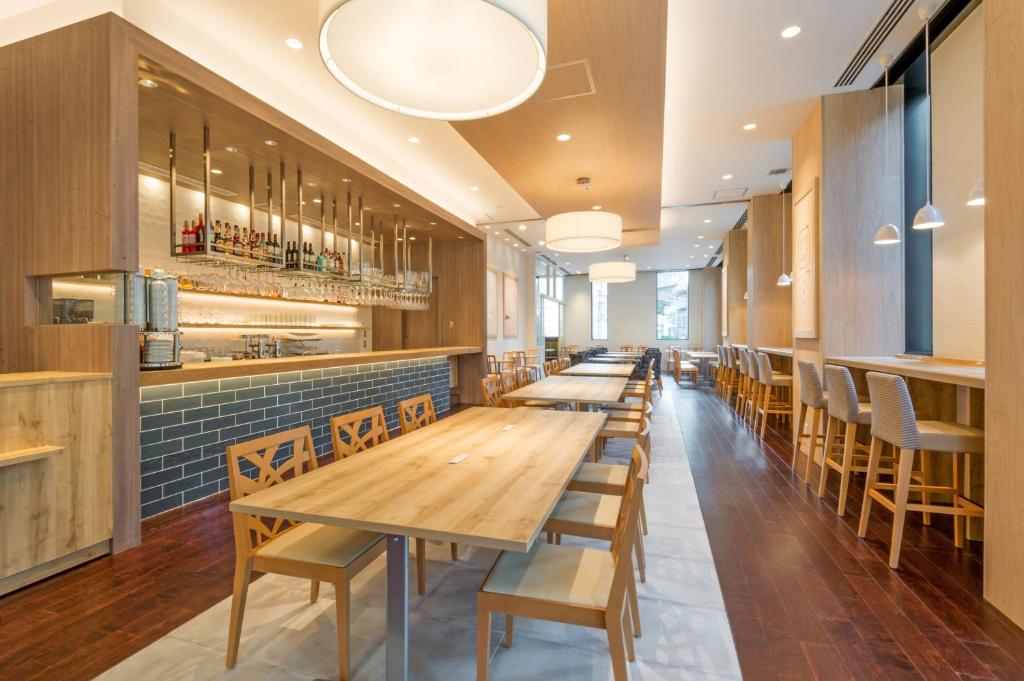 a row of tables and chairs in a restaurant at Hotel Mystays Premier Akasaka in Tokyo