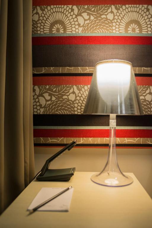 a lamp sitting on top of a table at Best Western Melbourne City in Melbourne
