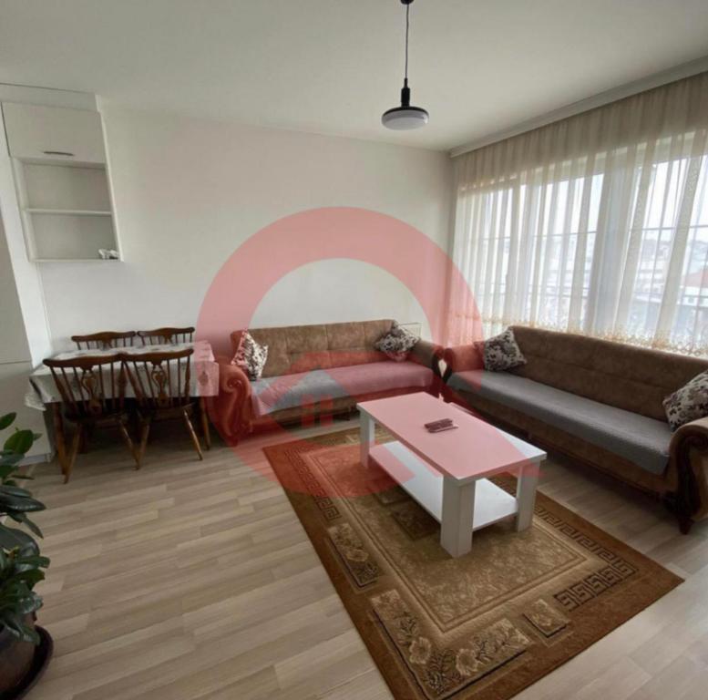 Khu vực ghế ngồi tại Cozzy Apartment